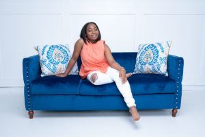 Black woman on a couch during session with Columbia Photographer MoSeawell