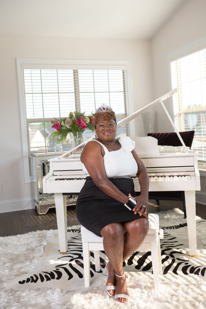Woman sitting at piano with Columbia Photographer Todd